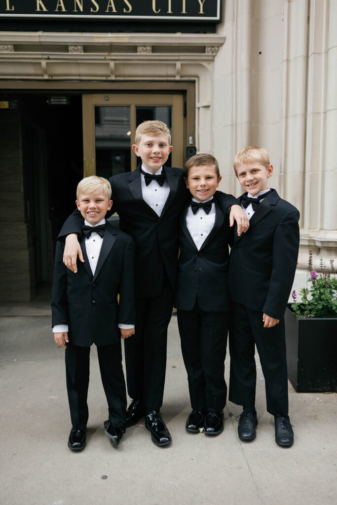 boys in suits outside of hotel Kansas City